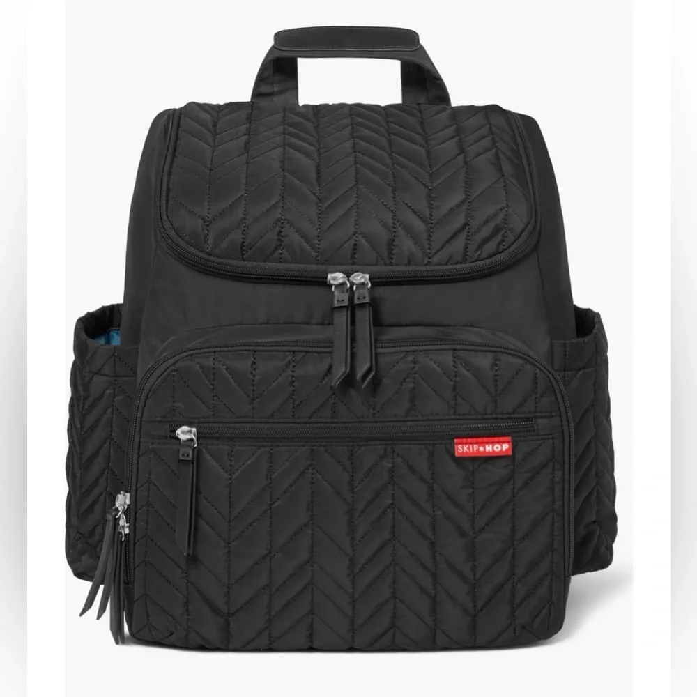Skip Hop Forma Diaper Backpack. Black Exterior with Teal Interior.